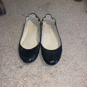 Shiny black flats